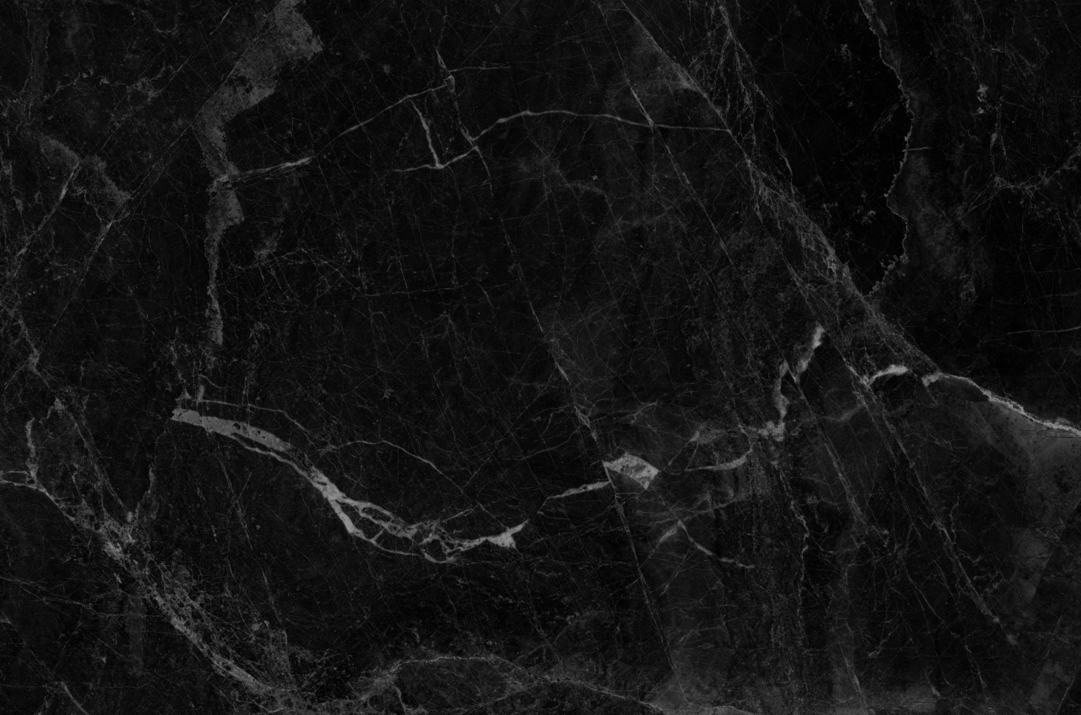 Black marble texture background with white veins.