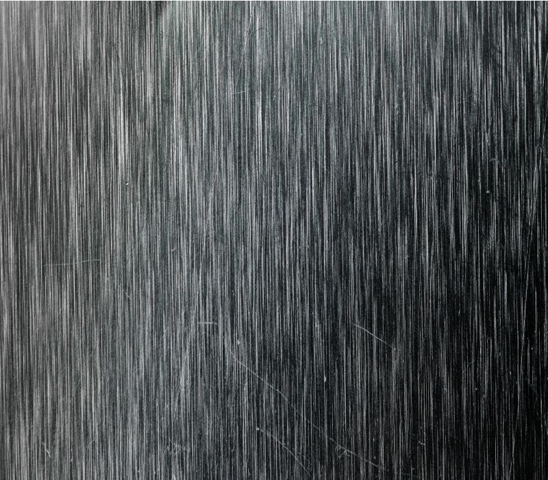 Brushed metal texture with vertical lines.