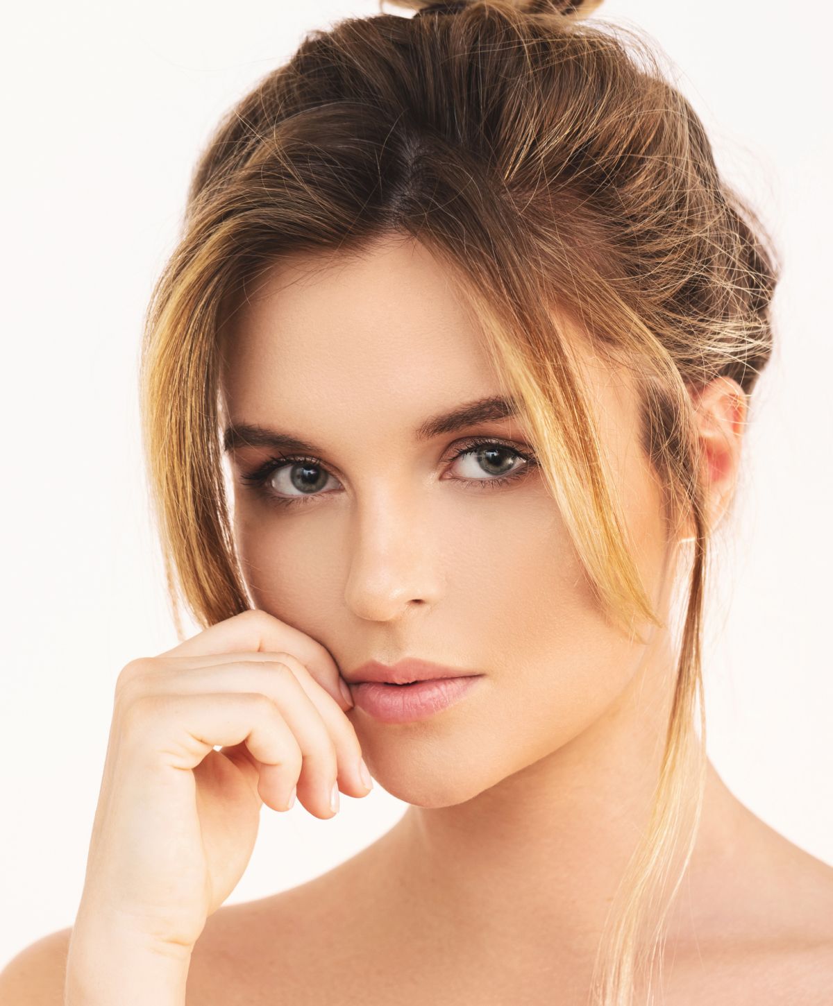 Close-up portrait of a woman with gentle expression.