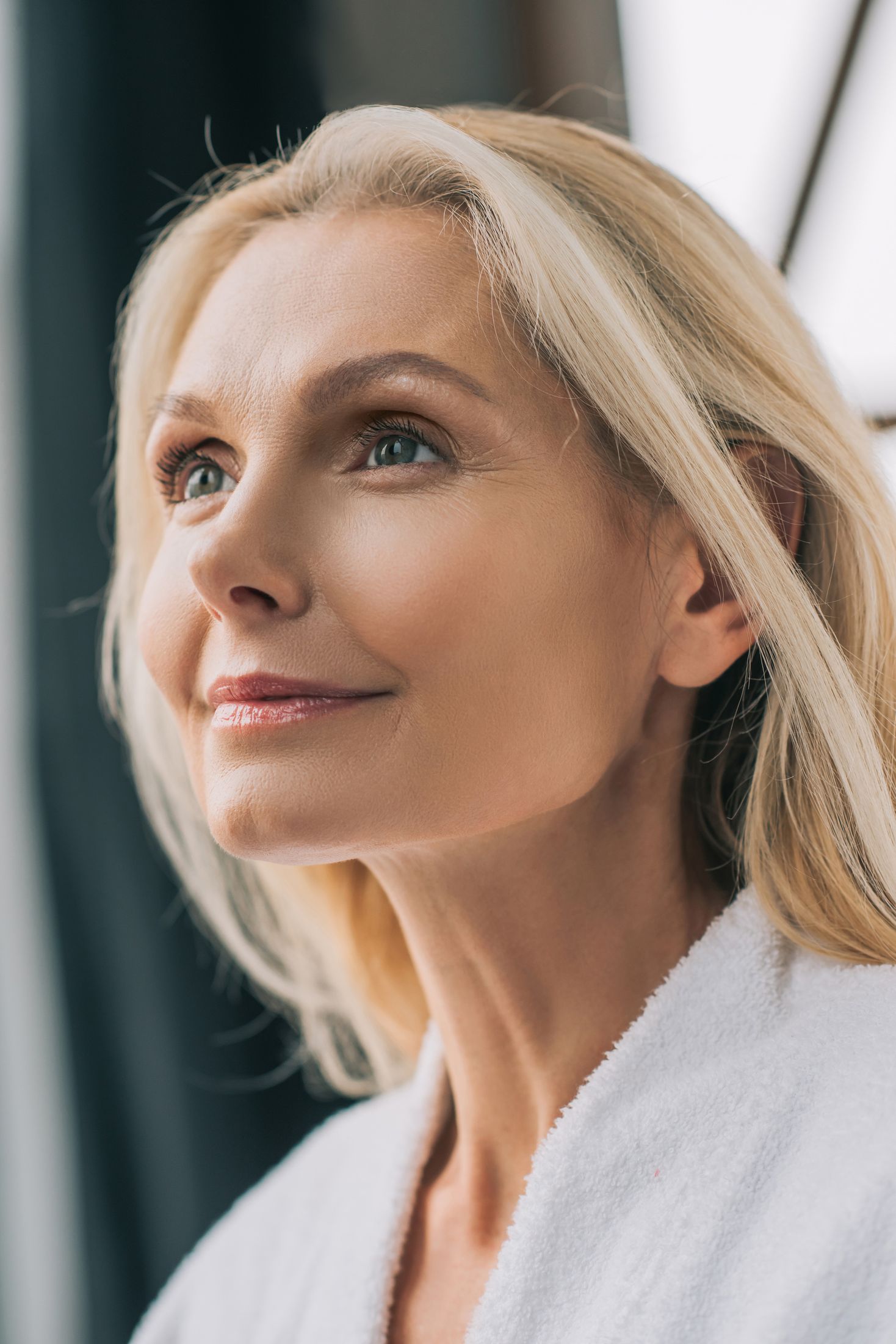Profile view of a woman with long brown hair.